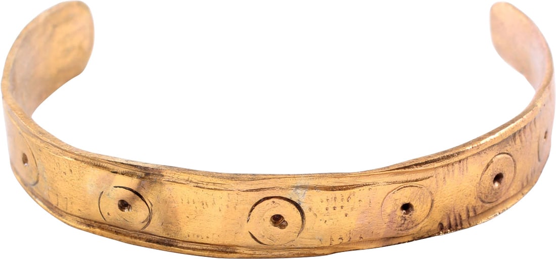 VIKING WOMAN WARRIOR'S BRACELET 850-1050 AD: Gilt bronze, C form, about 3/8" (2.36" �) inside dimension, with spatulate terminals. Hand decorated with line bordered and a series of large circle and dot motifs with hatching between. Some