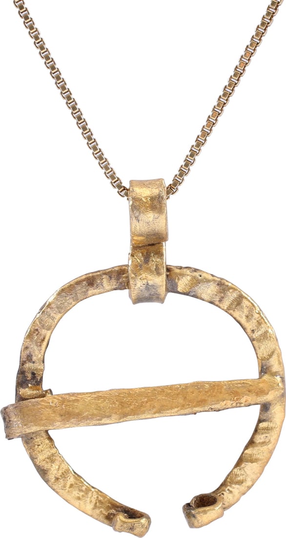 VIKING PROTECTIVE BROOCH C.850-1050 AD: Just under 1" (0.95") width, circular with radially reeded surface. The ends flattened and curled. Original cross pin. Worn in numbers on the leather war jerkin, at an ounce each, a few pounds could b