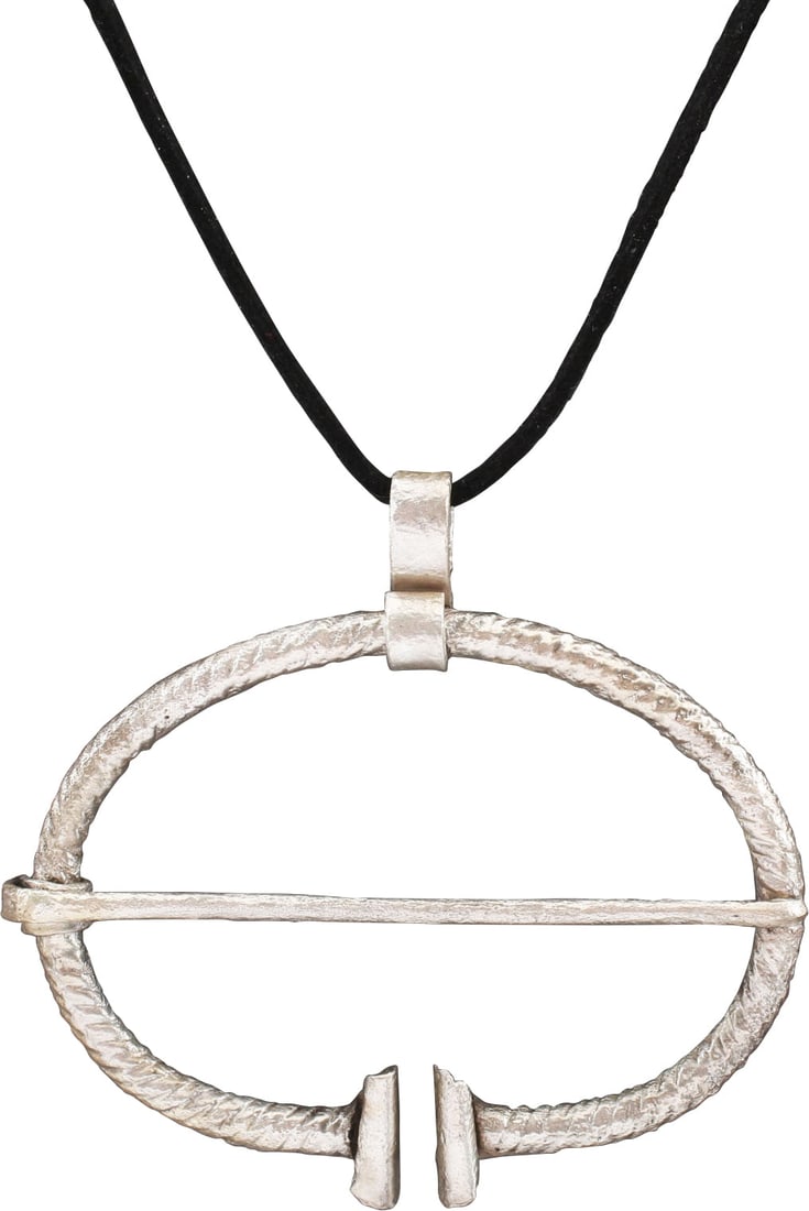 VIKING PROTECTIVE BROOCH, 850-1050 AD.: Over 2 1/2" width, oval form, and round section, roped completely around (inside and out) with the reeded ends curled. Original cross pin. Worn in numbers on the leather war jerkin, at an ounce each,