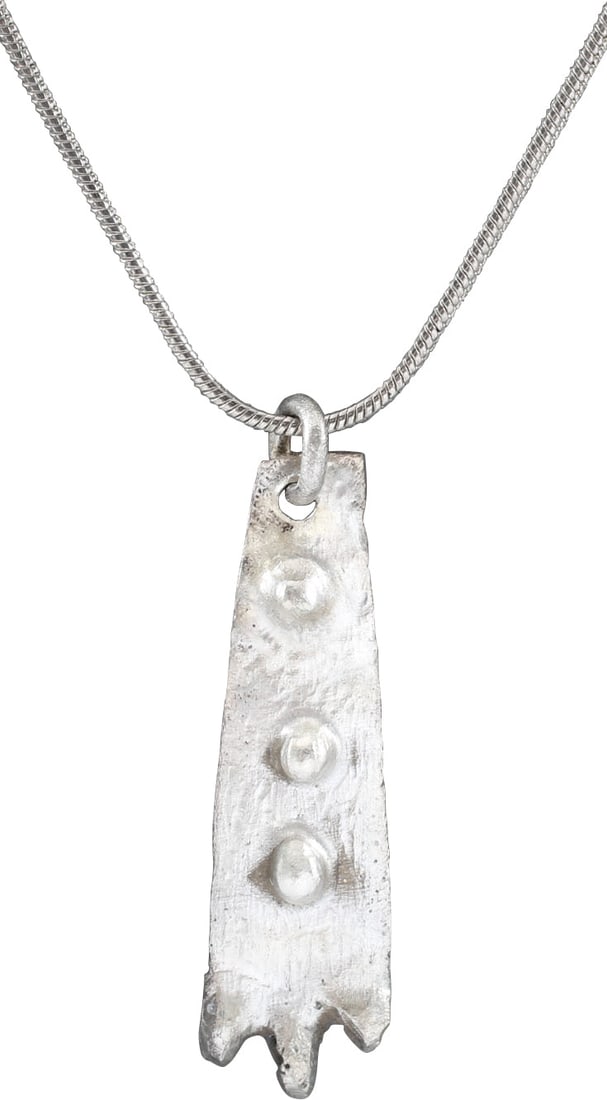 VIKING SORCERESS'S AMULET, 9TH-11TH CENTURY AD.: Over 1 3/8" height. Silvered bronze, shaped as a duck's foot with three toes and raised detail above top simulating scaly skin. A burial at Viden, Denmark contained the body of a woman of wealth and s