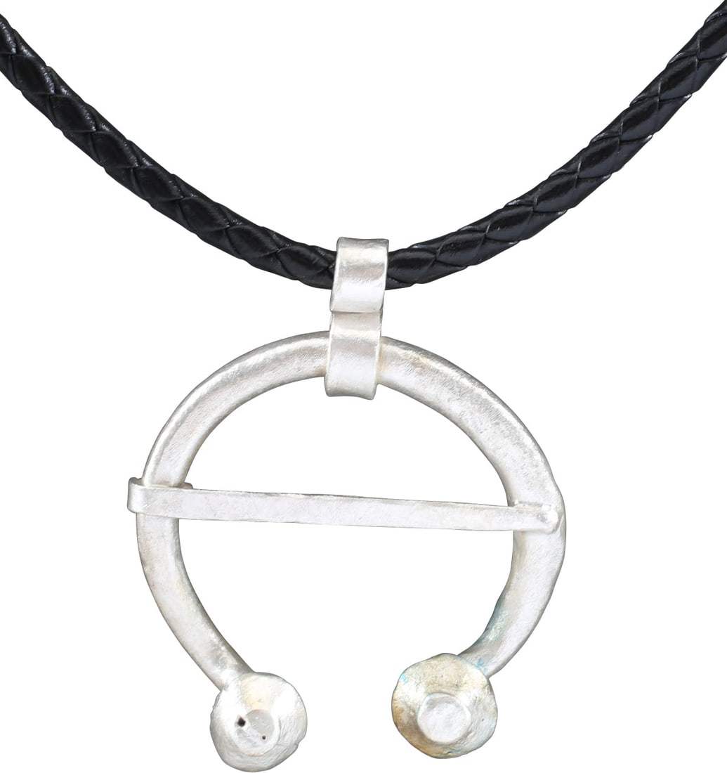 RARE VIKING PROTECTIVE BROOCH C.850-1050 AD: Very heavy example, about 1 3/4" width, oval form of rounded section with the ends projecting large baluster terminals. Tapered cross pin. Worn in numbers on the leather war jerkin, at an ounce each,