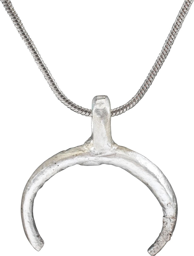 VIKING LUNAR PENDANT NECKLACE, 10TH-11TH CENTURY.: Fine example, just over 7/8" total height of elegant tapered form. As expert navigators, the constellations signified mystery and power to Vikings. The Moon was personified as Mani, brother to Sol the