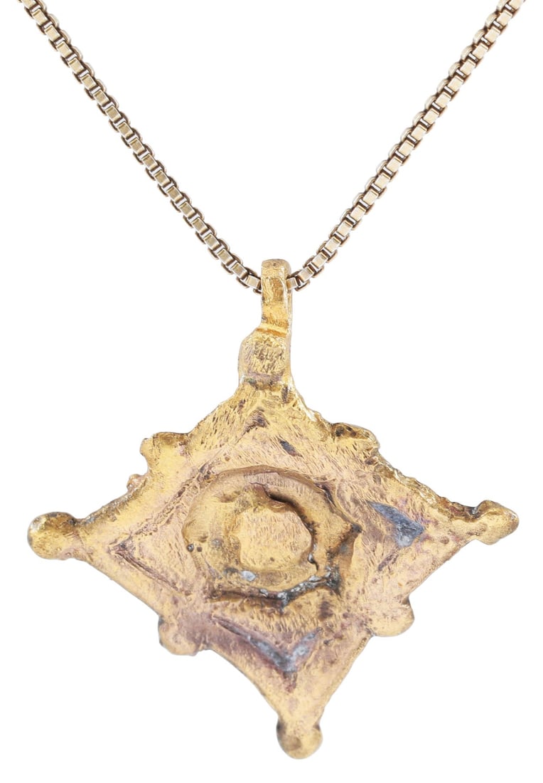 ITALIAN WOMAN’S PENDANT, C.1450-1650: Gilt bronze, just under 1/2" (0.46") total height, formed a diamond with nubs to the points and mid sides, enclosing an unidentified figure, which probably had spiritual or mystical significance. Prof