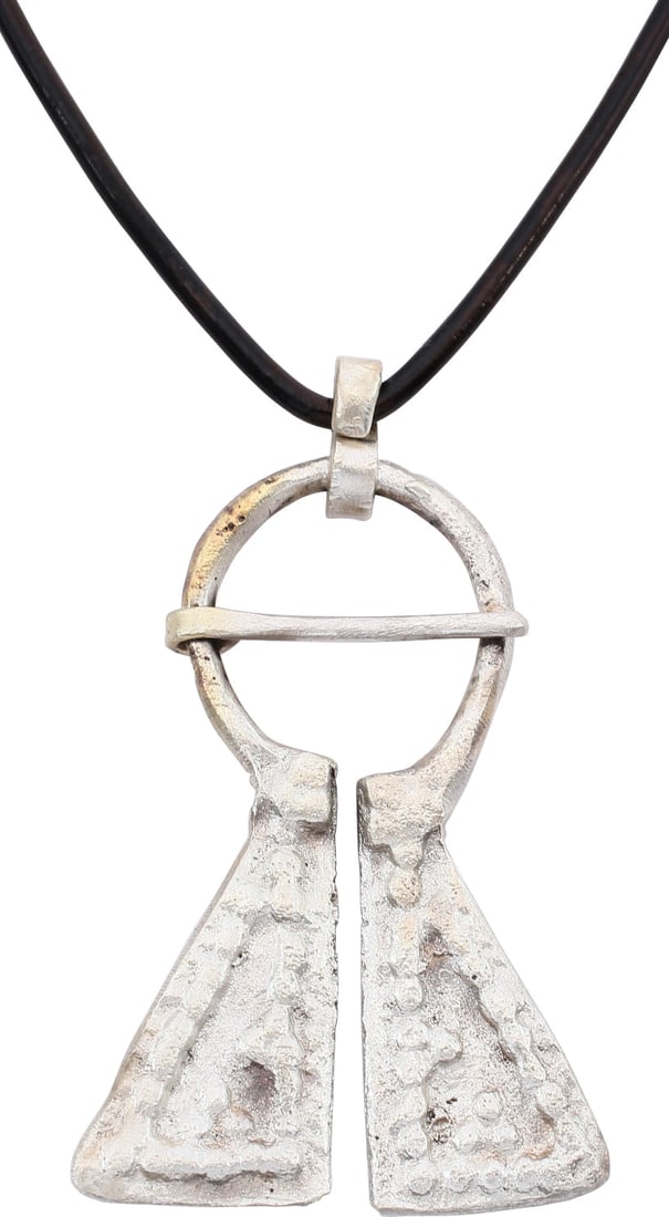 VIKING PROTECTIVE BROOCH, C.950-1050 AD: Large example, over 1 3/4" height of omega form. Circular top with large triangular terminals decorated in pelleted triangles within pelleted double line edges. When fastened to the jerkin, these smal