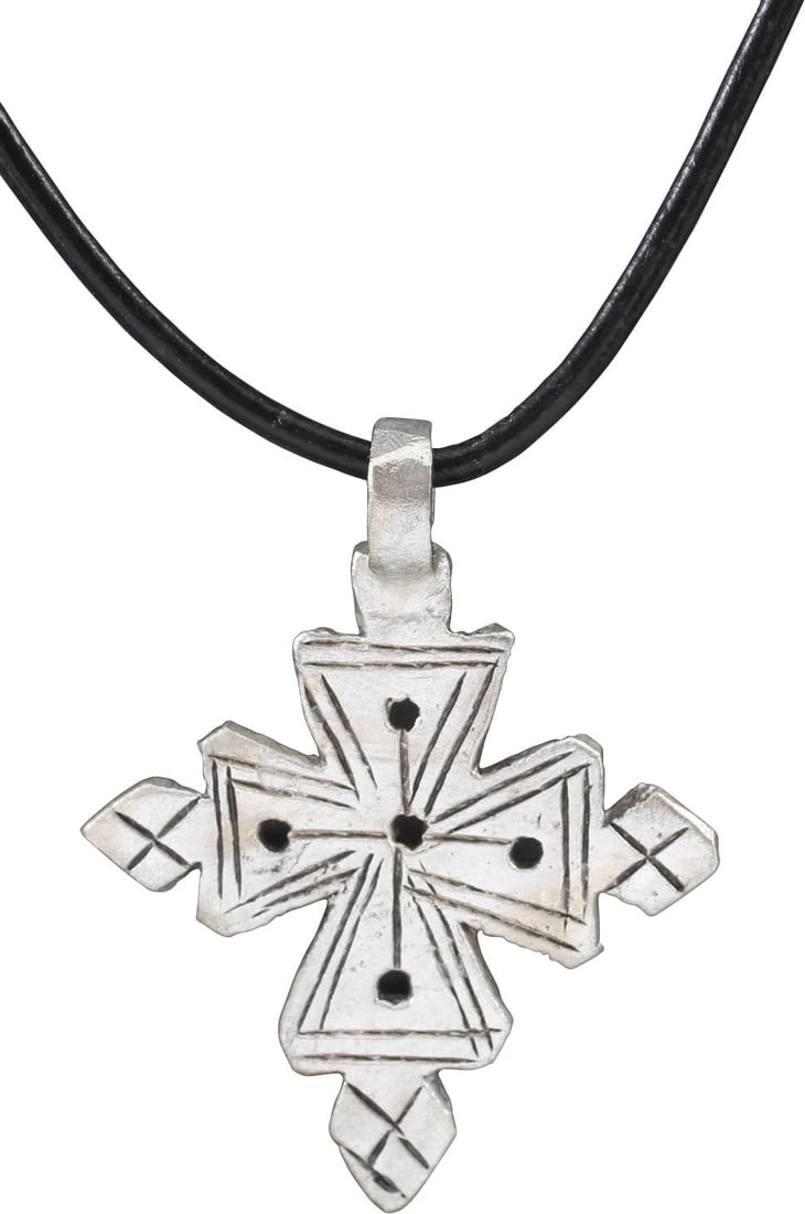 COPTIC CROSS NECKLACE, ETHIOPIA: White metal/base silver, over 1 1/4" height plus the loop. Of Maltese cross form the cross beam centered and each beam dramatically flared to the terminals which are surmounted by diamonds. Charming,