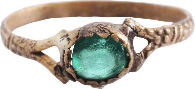 ENGLISH WEDDING RING, C.1400-1550, SIZE 5 1/2: C.1400-1550. Gilt bronze, size 5 ½ with 1.7mm roped band dividing to support the scalloped edge oval bezel, set with its original green “stone”. Very delicately made for a woman of st