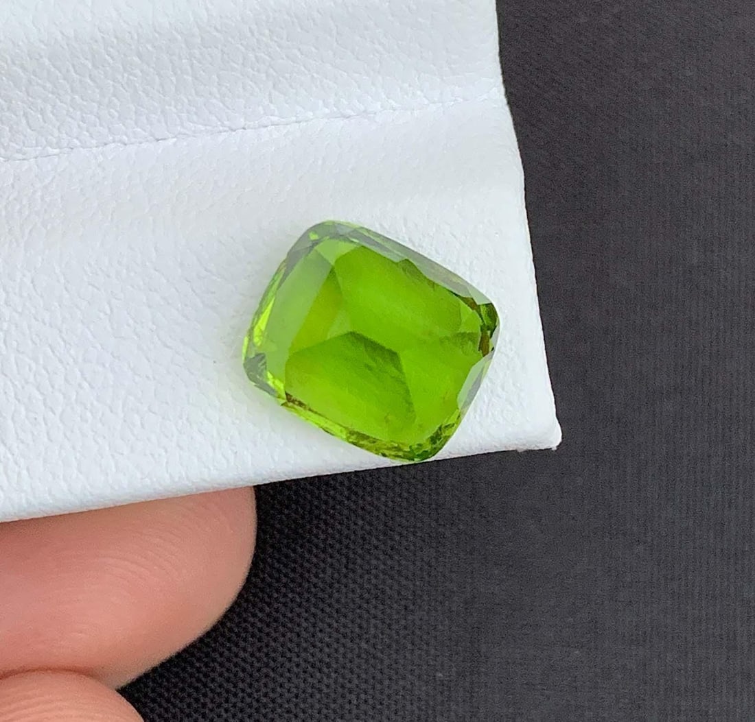 Cushion Cut Peridot Gemstone: Natural August Birthstone, Pakistan (5.96 carats): Materials: Gemstone: Peridot Natural Peridot Gemstones, Cushion Cut Peridot Loose Gemstone From Pakistan, August Birthstone weight : 5.96 carat Dimensions : 10.200 * 9.000 * 7.000 MM Shape : Cushion C