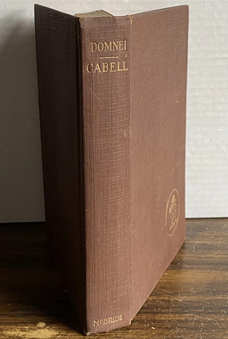 Domnei James Branch Cabell 1st/3rd Printing 1923 HC VGood Robert McBride NY: DOMNEI A Comedy of Woman-Worship by James Branch Cabell Robert McBride, New York 1923 First Edition, Third Printing HC no DJ Brown cloth boards Gilt decoration to front cover, gilt title to spine Tigh