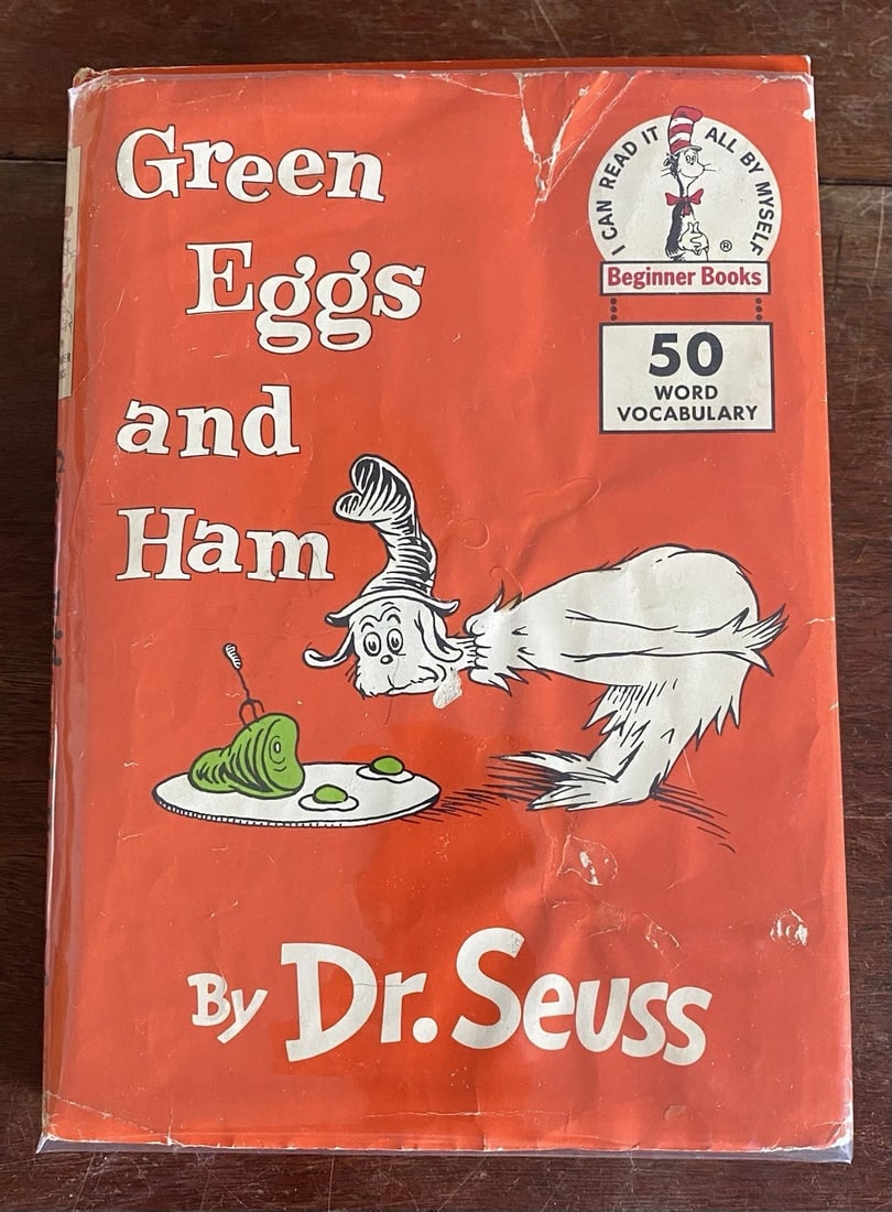 Dr Seuss GREEN EGGS AND HAM 1960 First Edition 2nd Printing Very Good In Good DJ: Dive into the whimsical world of Dr. Seuss with the classic "Green Eggs and Ham," a treasured piece from 1960. This hardcover gem, published by Beginner Books/Random House, presents the beloved story