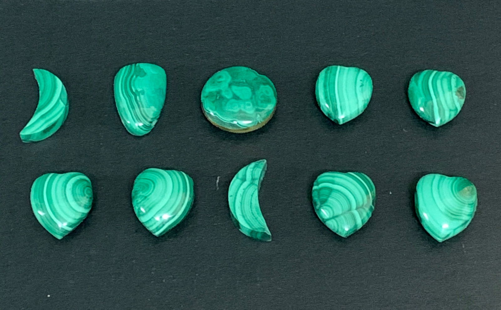 Carved Malachite Stone Pendant 10 Pcs.: Title: Carved Malachite Stone Pendant 10 Pcs.Date/Period: Late 20th CenturyMaterials: MalachiteDescription: Carved Malachite Stone Pendant 10 Pcs. Reserve: $60.00 Shipping:Domestic: Flat-rate of