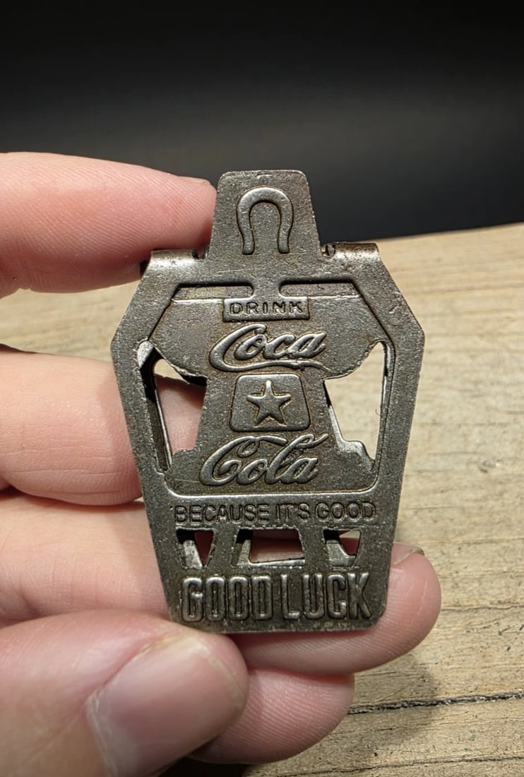 Metal Coca-Cola “Good Luck” Advertising Clip: Title: Metal Coca-Cola “Good Luck” Advertising Clip Description: Reproduction Coca-Cola “Good Luck” Advertising Clip This cast metal reproduction spring loaded Coca-Cola Good L