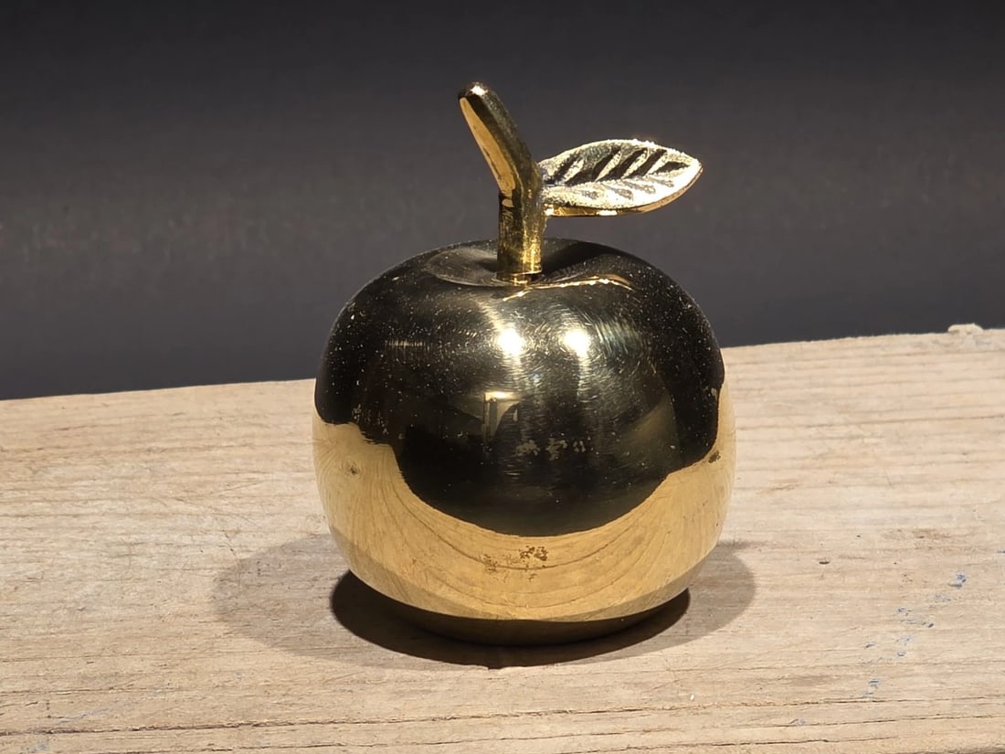 Schoolhouse Brass Apple Bell: Title: Schoolhouse Brass Apple Bell Description: Schoolhouse-Style Brass Apple Bell This reproduction brass bell is shaped as a classic apple, a long-standing symbol of learning and respect for the te