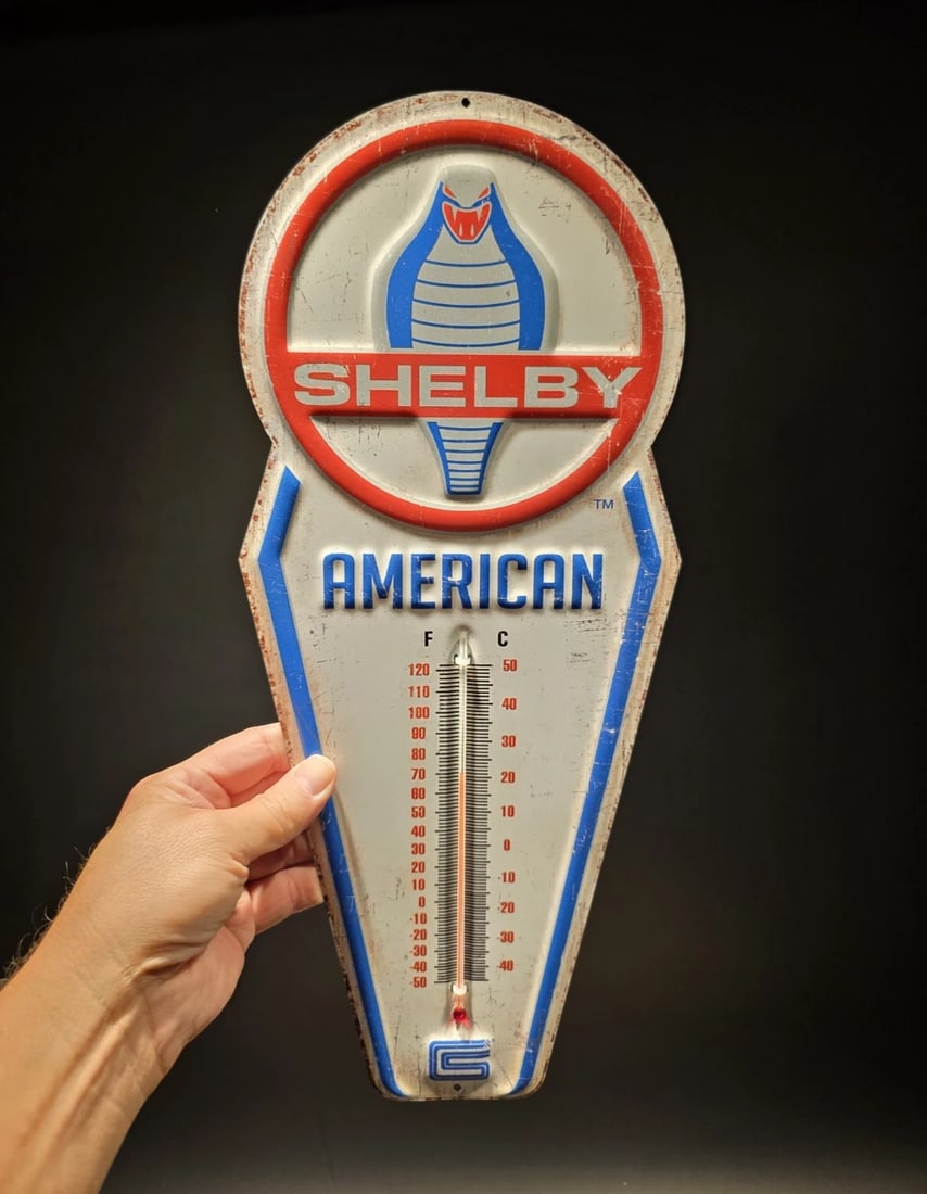 17.5 " Metal Vintage Style Ford Shelby American Thermometer Sign: Title: 17.5 " Metal Vintage Style Ford Shelby American Thermometer Sign Description: 17.5 This classic reproduction Ford Shelby thermometer is a must-have for any garage or man cave. Crafted from dura
