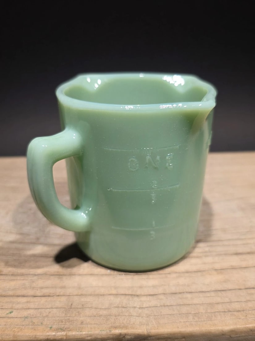 1 Cup Jadeite Depression Glass Retro: Title: 1 Cup Jadeite Depression Glass Retro Description: Reproduction never used jadeite green glass 1 cup measure. These measuring cups were popular in the early to mid-20th century and are often ass