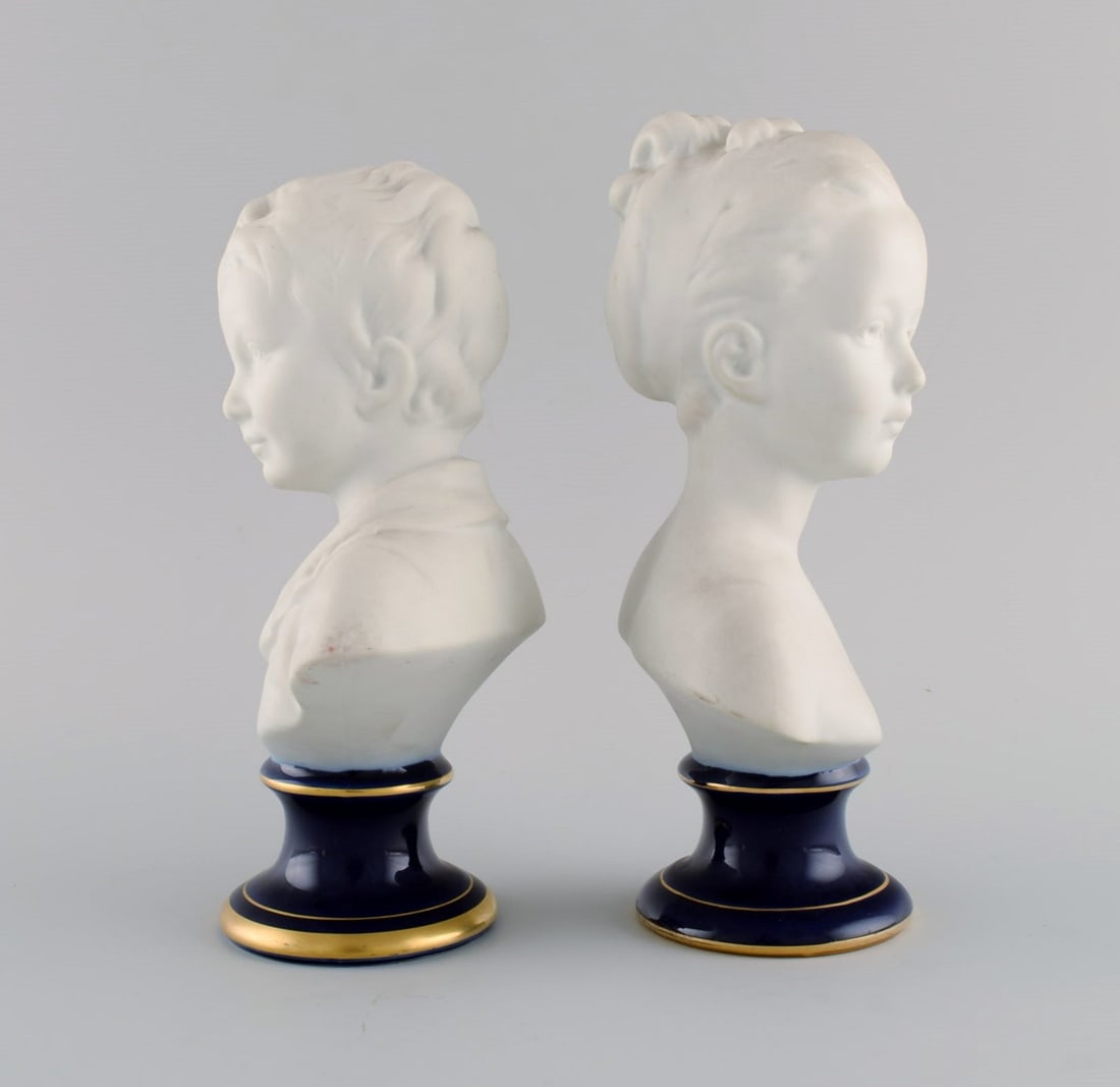 Limoges France. Two child busts in biscuit. Stand with dark blue glaze and gold edges. Classic - 4