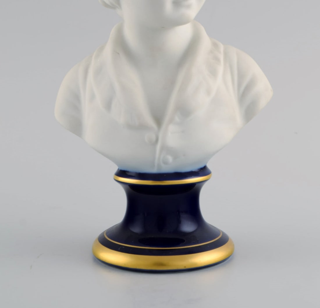 Limoges France. Two child busts in biscuit. Stand with dark blue glaze and gold edges. Classic - 7