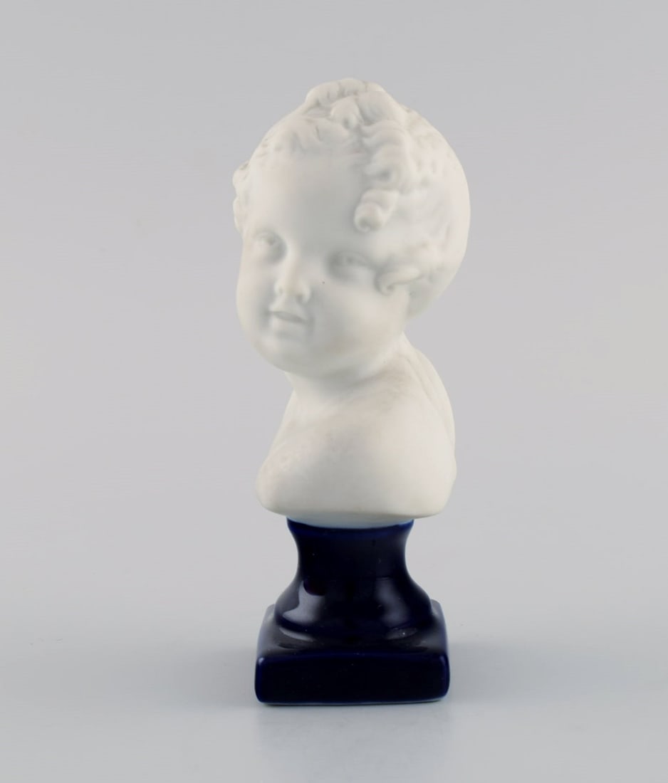 Limoges France. Biscuit child bust. Stand with dark blue glaze. Classic style. Early 20th century. - 2