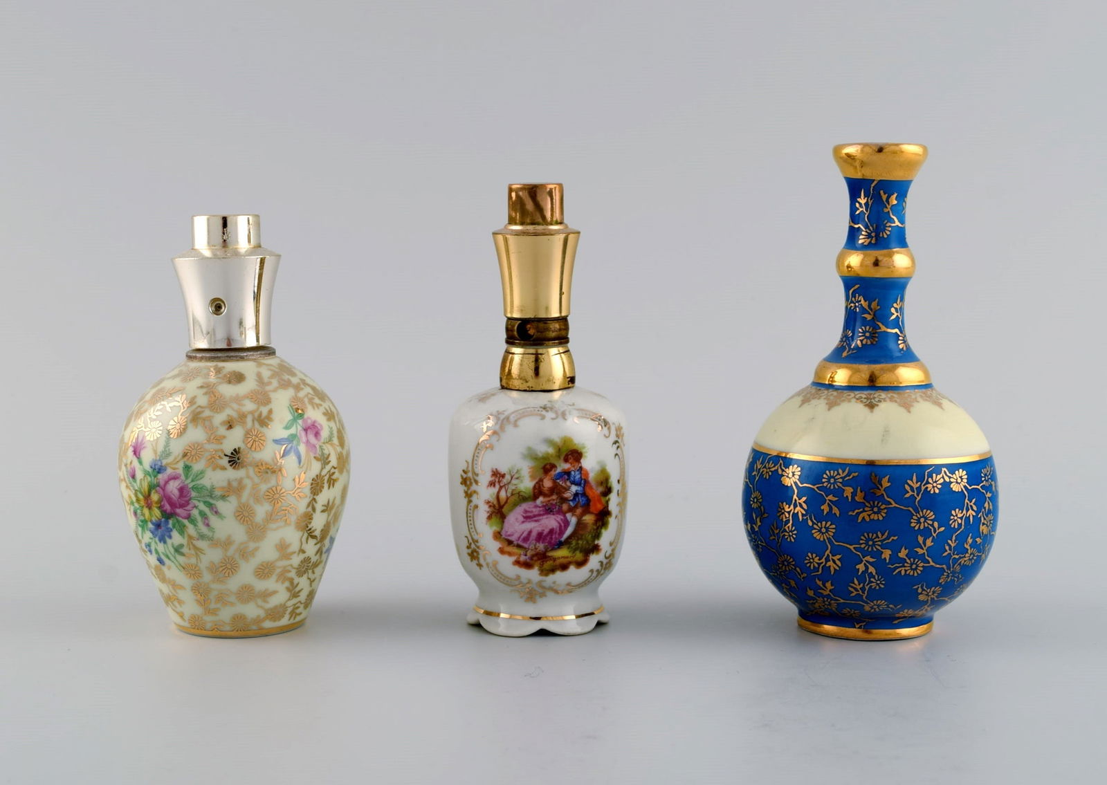 Limoges, France. Two perfume bottles, three vases and lidded box in hand-painted porcelain. Flowers - 4