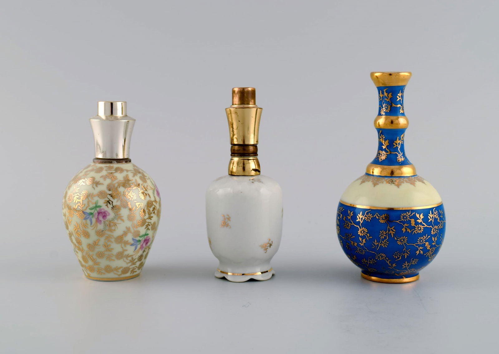 Limoges, France. Two perfume bottles, three vases and lidded box in hand-painted porcelain. Flowers - 5