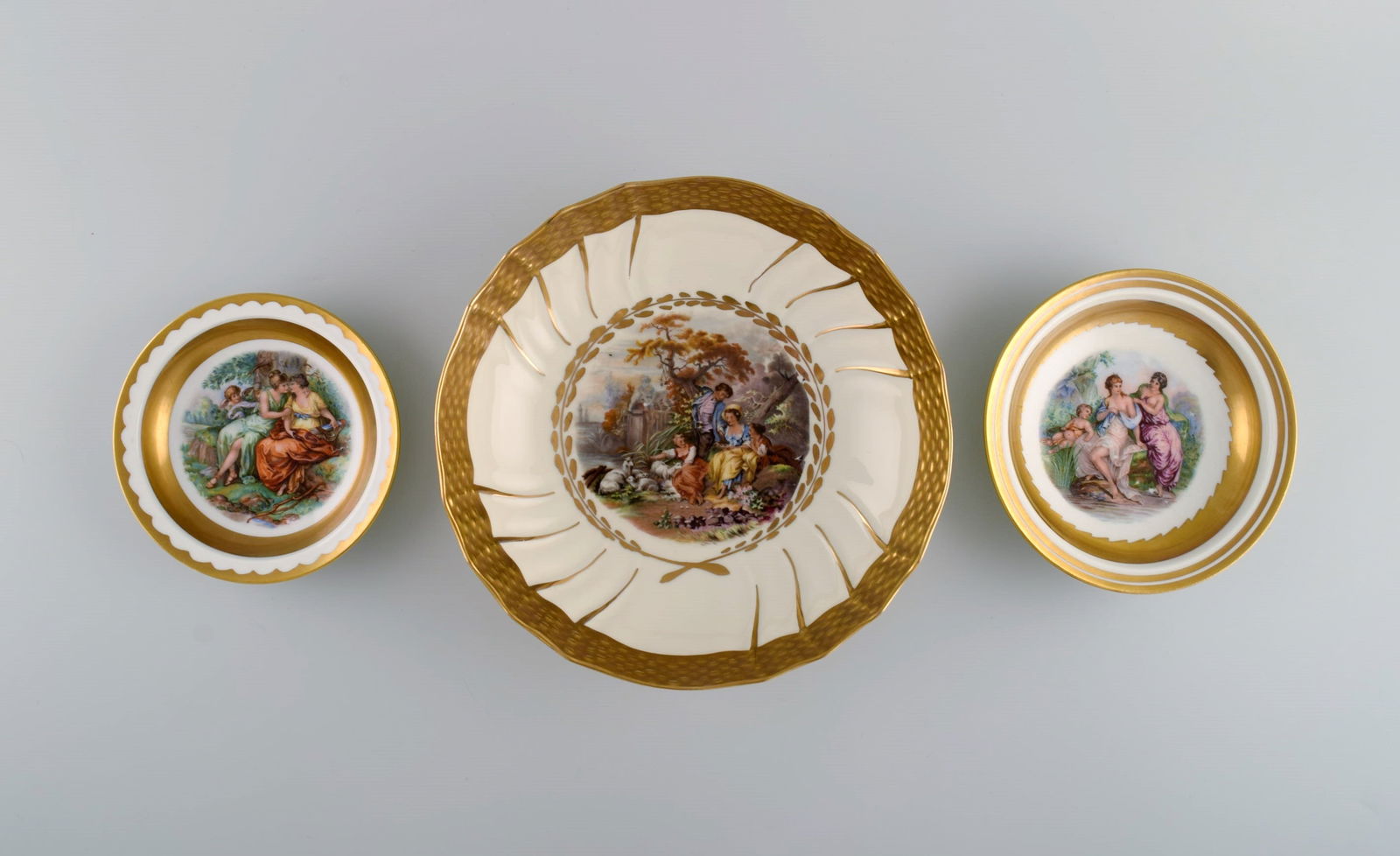 Three Royal Copenhagen bowls decorated with flowers and romantic scenery. Gold decoration. Mid-20th (1 of 7)