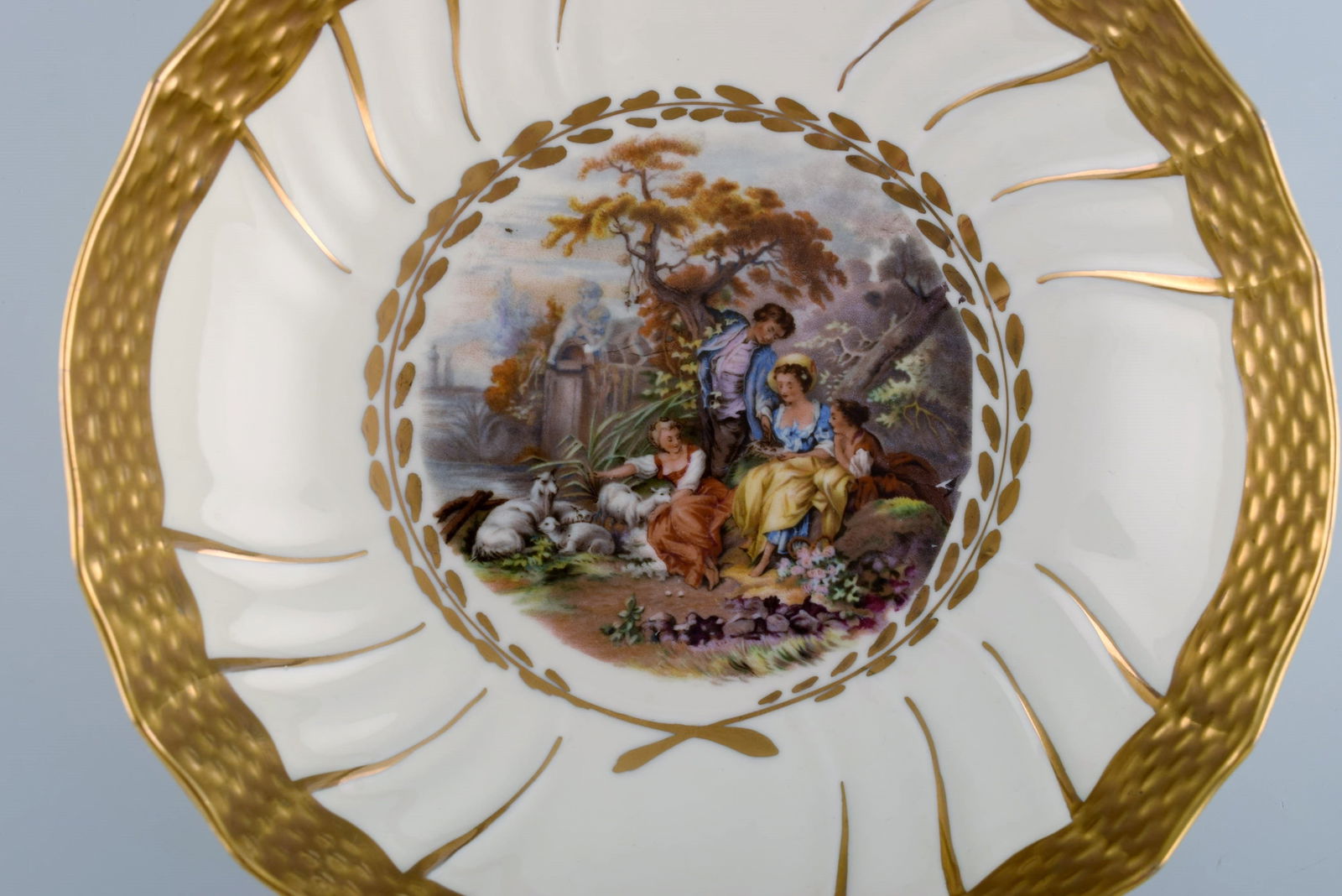 Three Royal Copenhagen bowls decorated with flowers and romantic scenery. Gold decoration. Mid-20th - 4