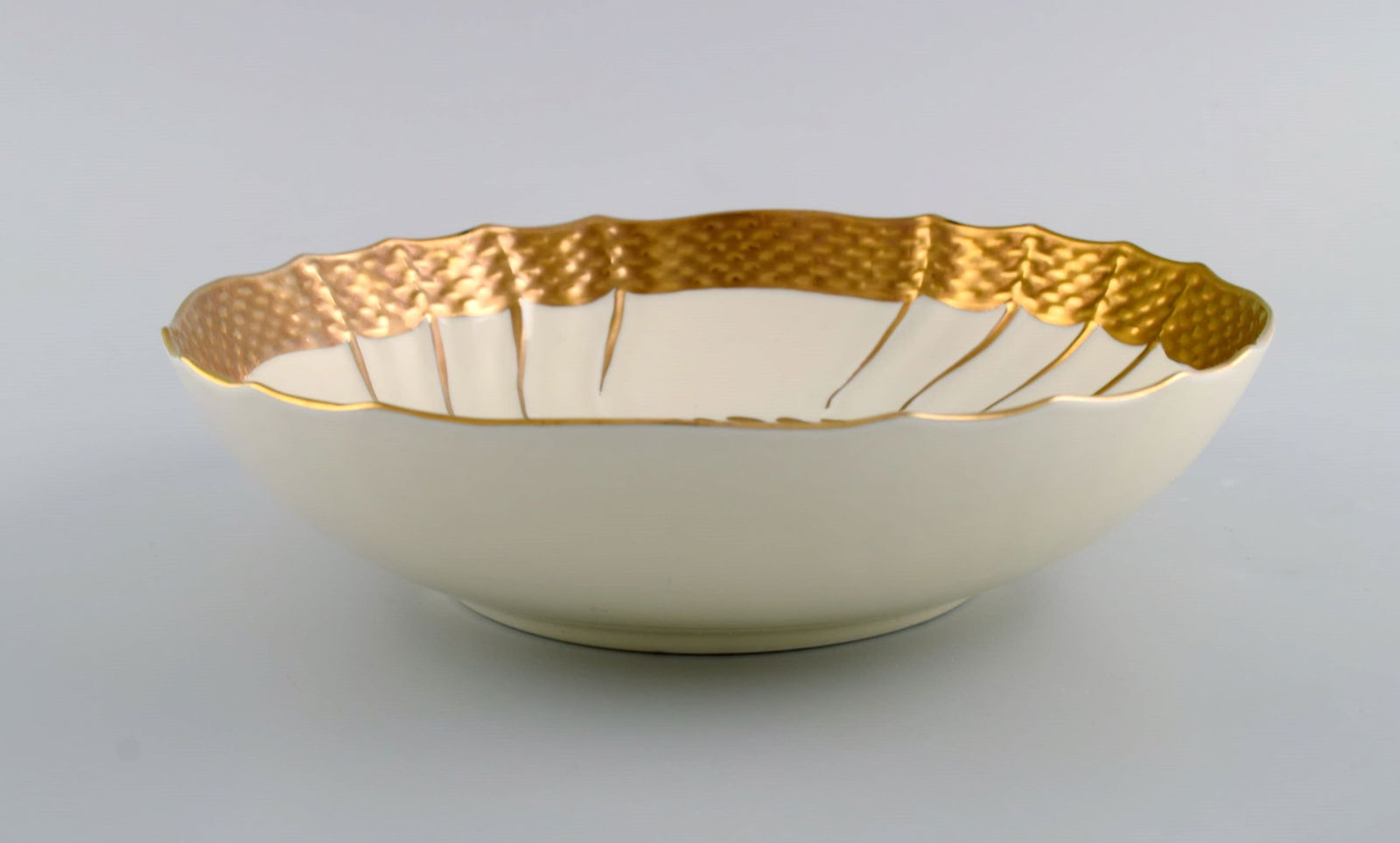 Three Royal Copenhagen bowls decorated with flowers and romantic scenery. Gold decoration. Mid-20th - 5