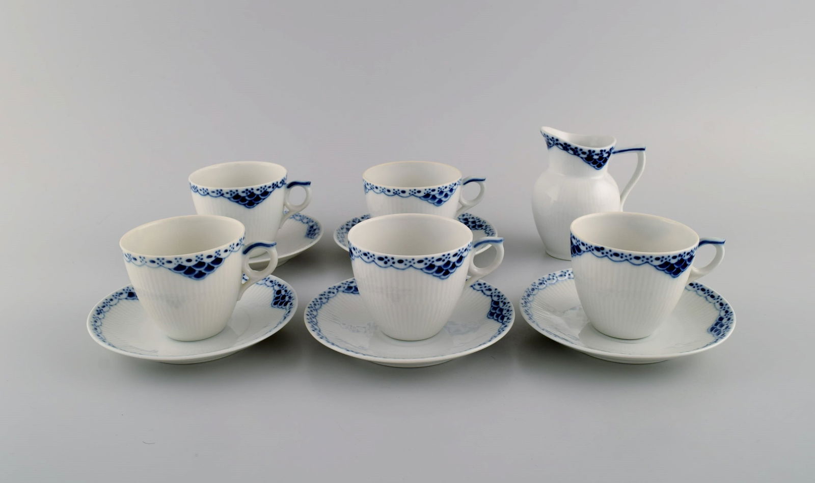 Royal Copenhagen blue painted Princess. Set of five coffee cups with saucers along with creamer in (1 of 6)