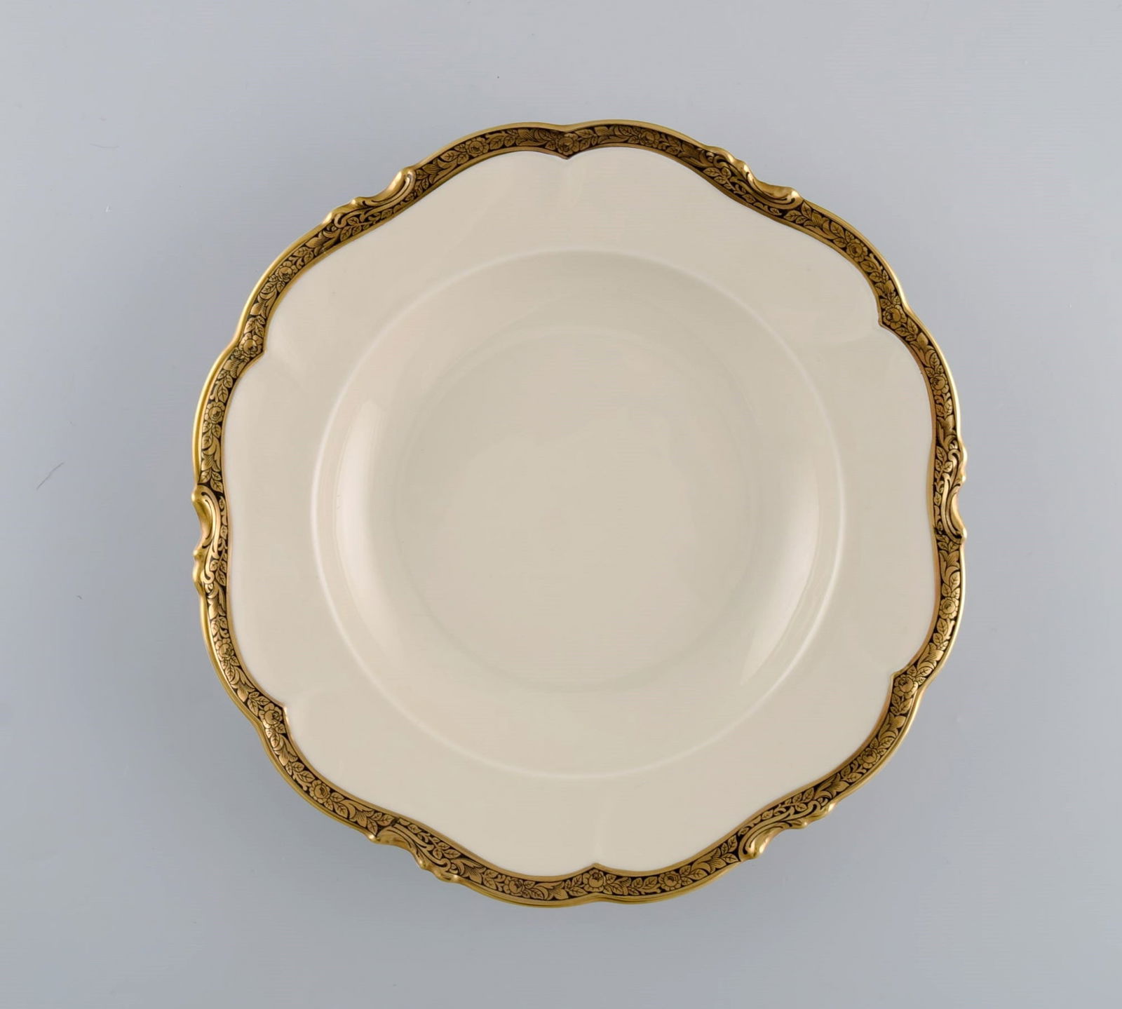 KPM, Berlin. Six Royal Ivory deep plates in cream-colored porcelain with gold decoration. 1920s. - 2