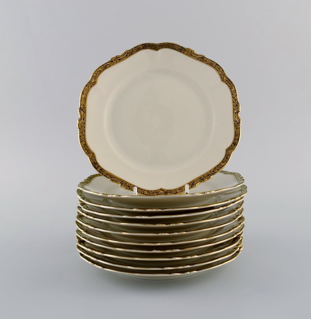 KPM, Berlin. 11 Royal Ivory cake plates in cream-colored porcelain with gold decoration. 1920s. (1 of 5)