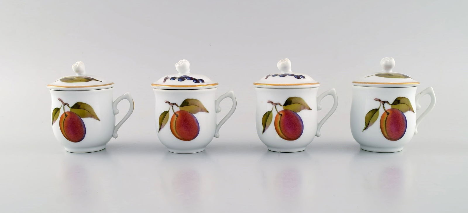Royal Worcester, England. Four Evesham porcelain cream cups decorated with fruits and gold edge. (1 of 5)