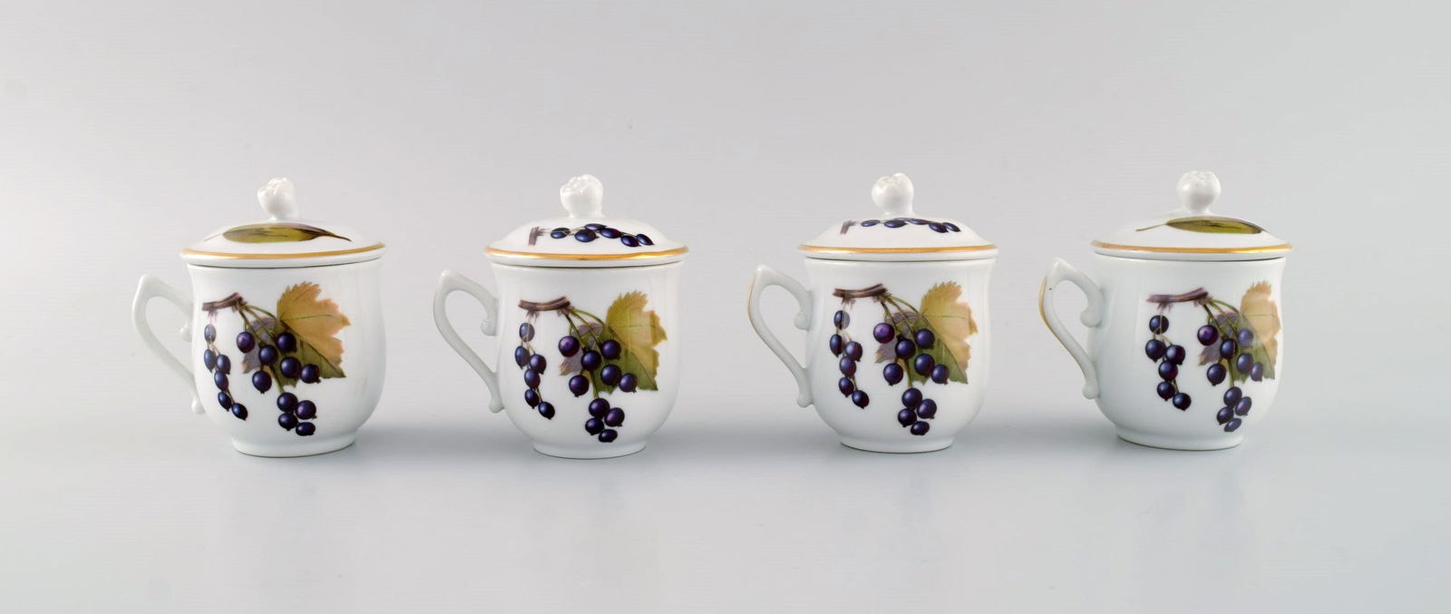 Royal Worcester, England. Four Evesham porcelain cream cups decorated with fruits and gold edge. - 2