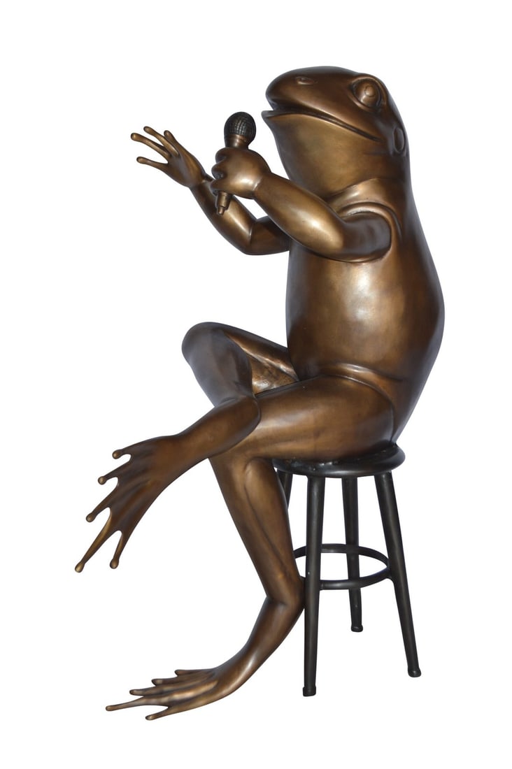Comedic Frog bronze statue - Size: 25"L x 20"W x 30"H.: Title:Comedic Frog bronze statue - Size: 25"L x 20"W x 30"H. Description:This humorous bronze statue depicts a frog seated on a stool ready to share a story with his microphone in hand. Some may say h