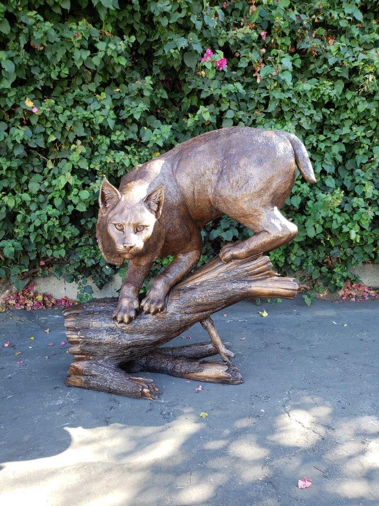 Bobcat Going Down a Tree Log Bronze Statue - Size: 43"L x 25"W x 41"H. - 2