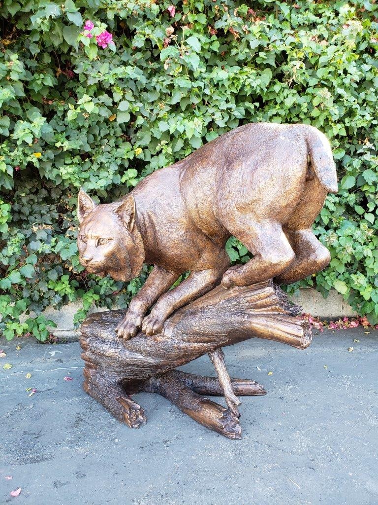 Bobcat Going Down a Tree Log Bronze Statue - Size: 43"L x 25"W x 41"H. - 4
