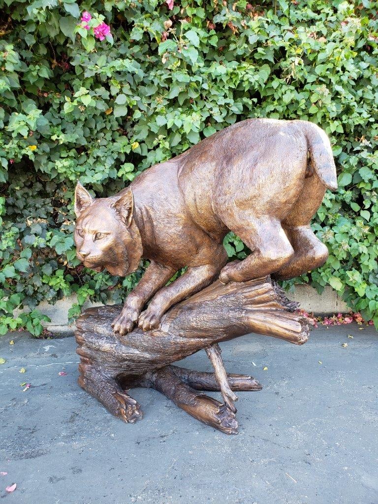 Bobcat Going Down a Tree Log Bronze Statue - Size: 43"L x 25"W x 41"H. - 5