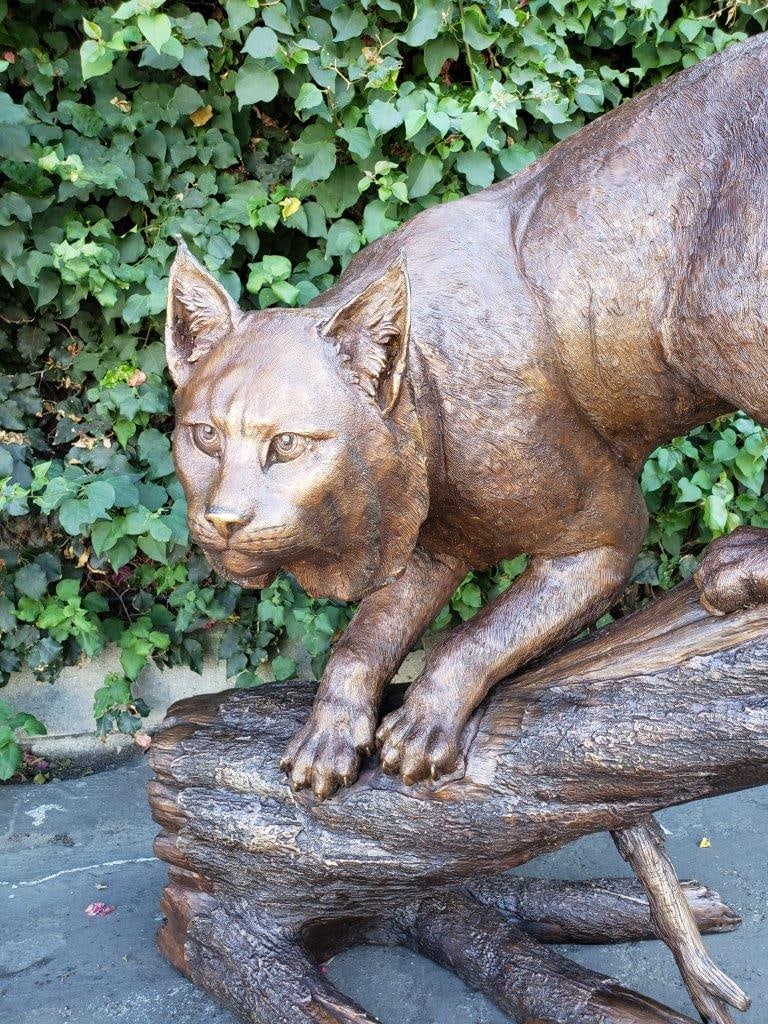 Bobcat Going Down a Tree Log Bronze Statue - Size: 43"L x 25"W x 41"H. - 6