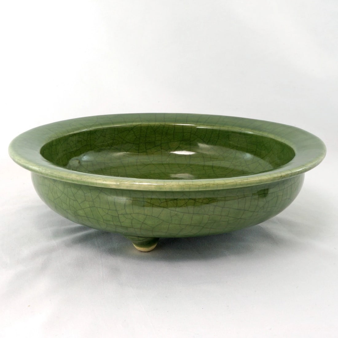 Large 19th C Chinese Celadon Tripod Censer: Title:Large 19th C Chinese Celadon Tripod CenserSize:9 ¾ in (24.8 cm) diameter x 2 ¾ in (7.0 cm) tall. Reserve: $425.00 Shipping:Domestic: Flat-rate of $29.00 to anywhere within the