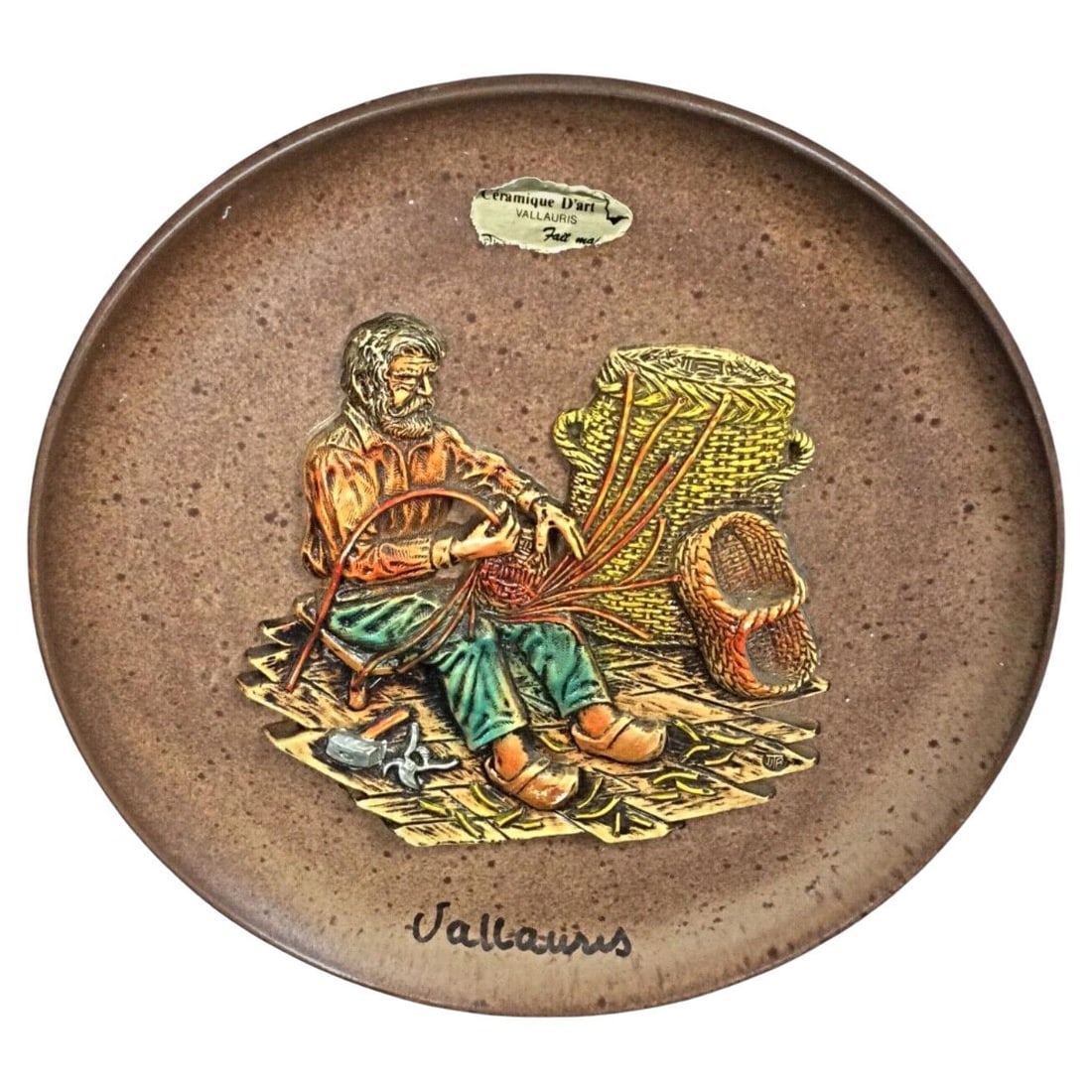 Vintage Vallauris Ceramic Plate with "Weaver" Bas-Relief: Title:Vintage Vallauris Ceramic Plate with "Weaver" Bas-ReliefOrigin:FranceDimension:Diameter: 24.5 cm (9.65 in)Height: 1.5 cm (0.6 in)Materials:CeramicYear:20th centuryDescription:This unique