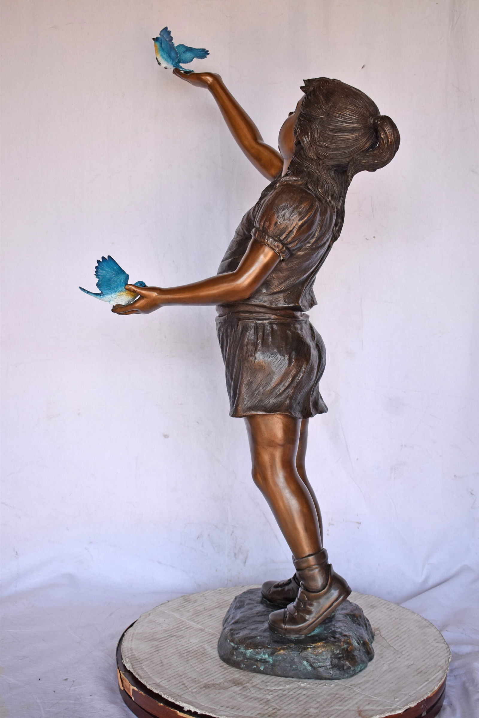 Girl, sandy, with two Blue birds Bronze Statue - Size: 25"L x 23"W x 41"H. - 10
