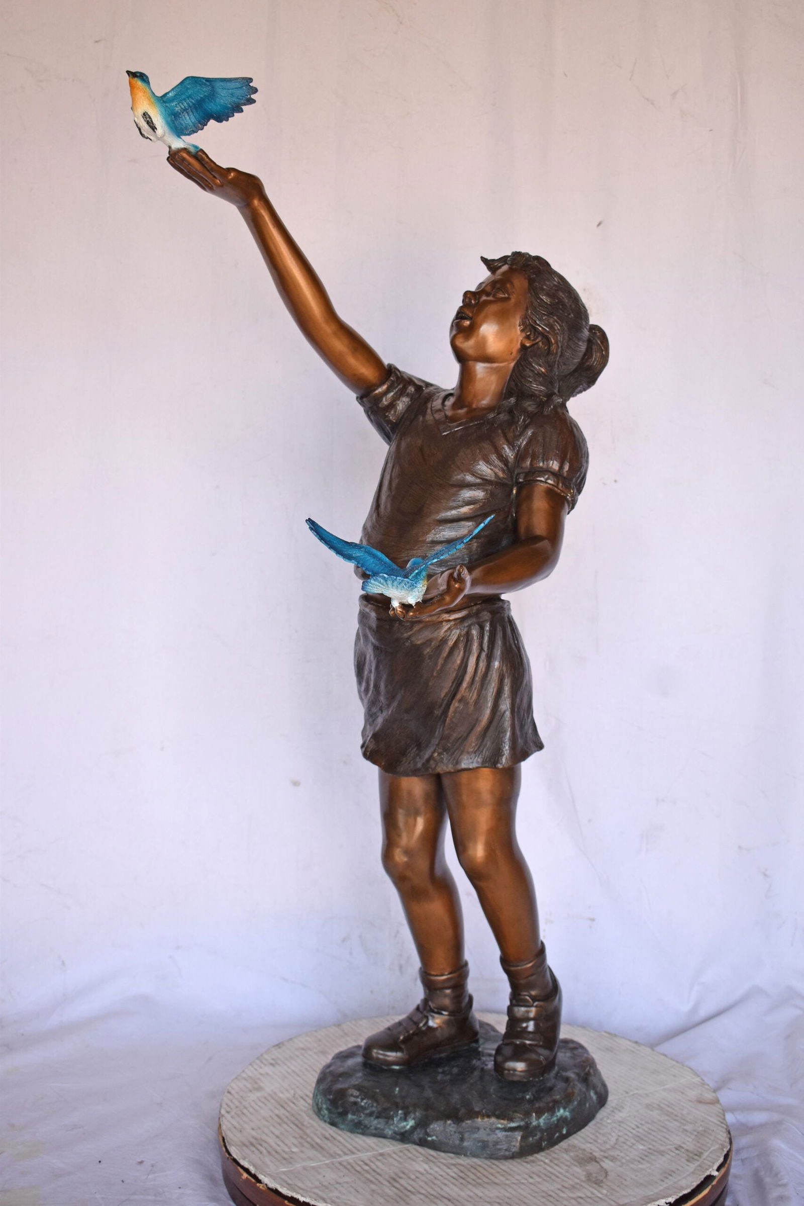 Girl, sandy, with two Blue birds Bronze Statue - Size: 25"L x 23"W x 41"H. - 12