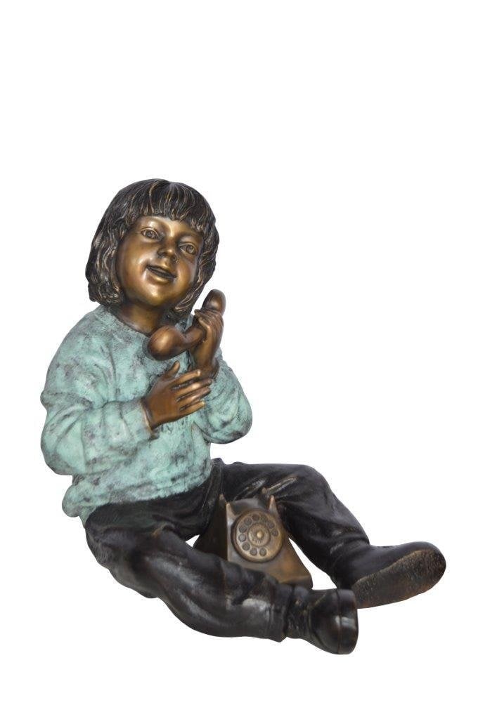 Young Child With an Old Telephone Bronze Statue - Size: 21"L x 14"W x 19"H.: Title:Young Child With an Old Telephone Bronze Statue - Size: 21"L x 14"W x 19"H.Description:This young child playing with a telephone of old will remind you of the good old days. The child, cast as