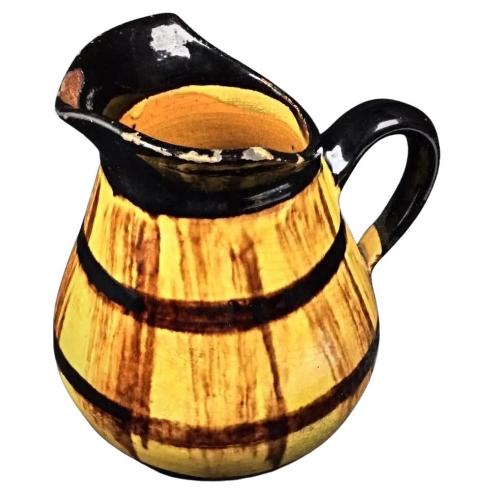 Vintage Barrel-Shaped Enameled and Crackled Pitcher: Title:Vintage Barrel-Shaped Enameled and Crackled Pitcher Origin:FranceDimension:Height: 16 cm (6.3 inches)Diameter: 12.5 cm (4.92 inches)Materials:EnamelYear:20th CenturyDescription:This vintage