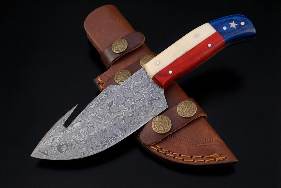 Handmade Damascus Steel Gut Hook Hunting Knife 8" Fixed Blade Texas Flag Handle: Title:Handmade Damascus Steel Gut Hook Hunting Knife 8" Fixed Blade Texas Flag HandleDescription:This is a hand-forged Damascus steel hunting knife, featuring a fixed blade with an integrated gut