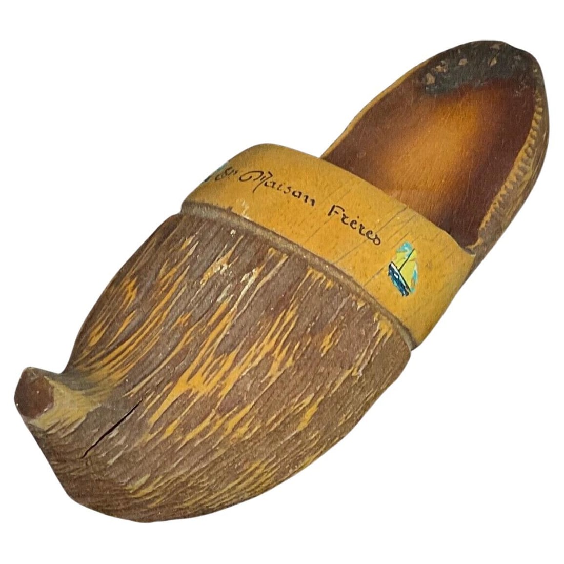 Antique 20th-Century Wooden Clog by "Ets Maison Frères" – France: Title:Antique 20th-Century Wooden Clog by "Ets Maison Frères" – FranceOrigin:FranceDimension:Height: 2.76 in (7 cm)Width: 9.06 in (23 cm)Depth: 2.76 in (7 cm)Materials:WoodYear:Early 20th