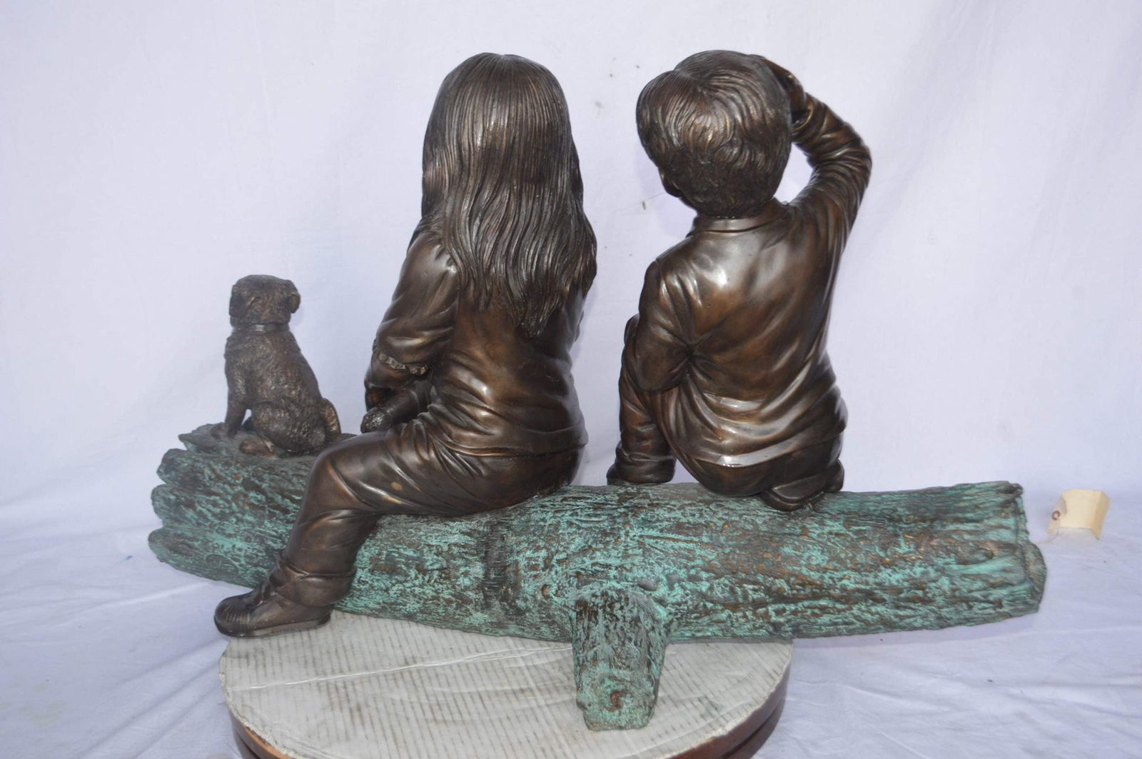 Young children and dog on a log bronze statue - Size: 40"L x 16"W x 24"H. - 8