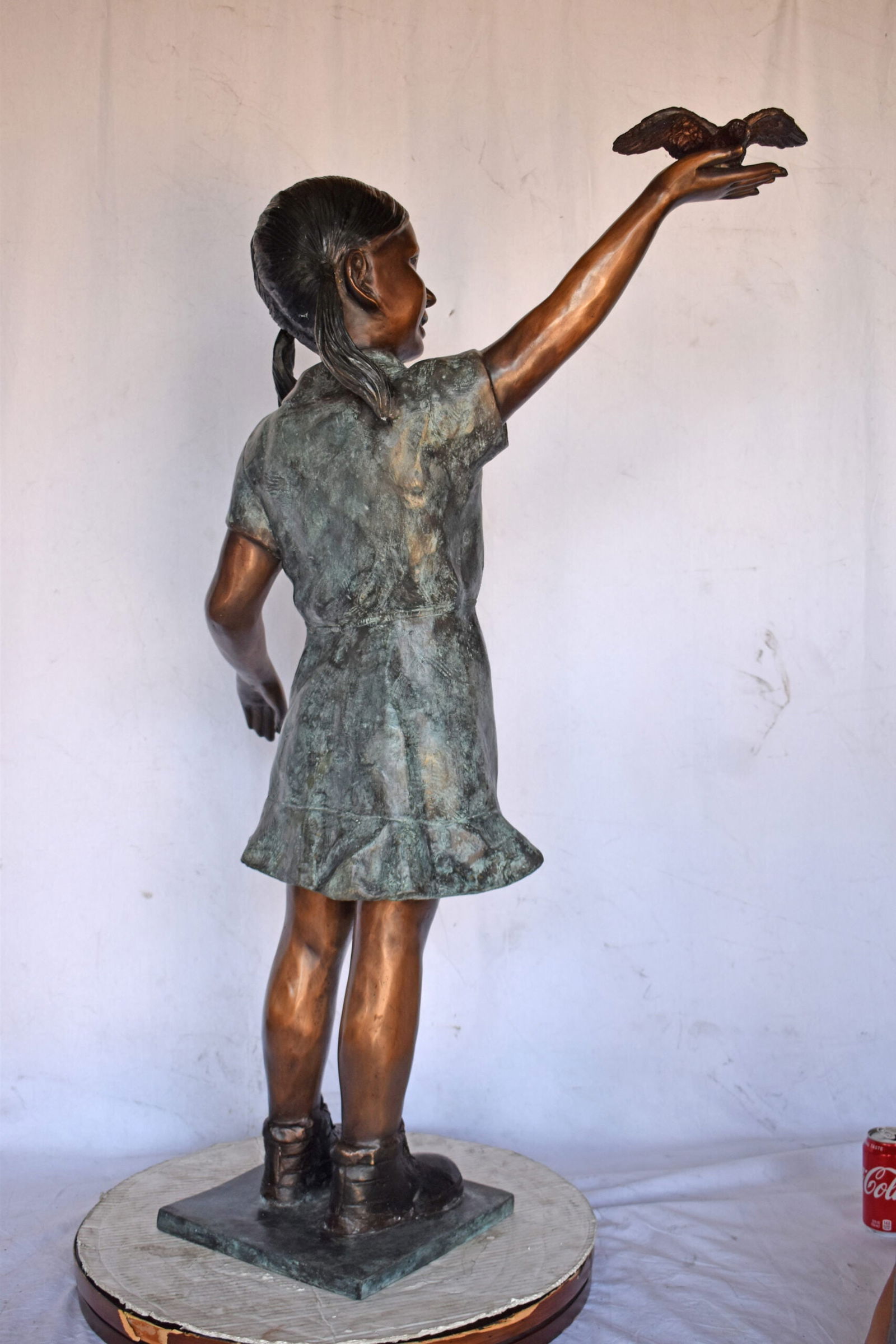 Young Girl Holding a Bird Outside at The Park - Size: 21"L x 11"W x 49"H. - 7