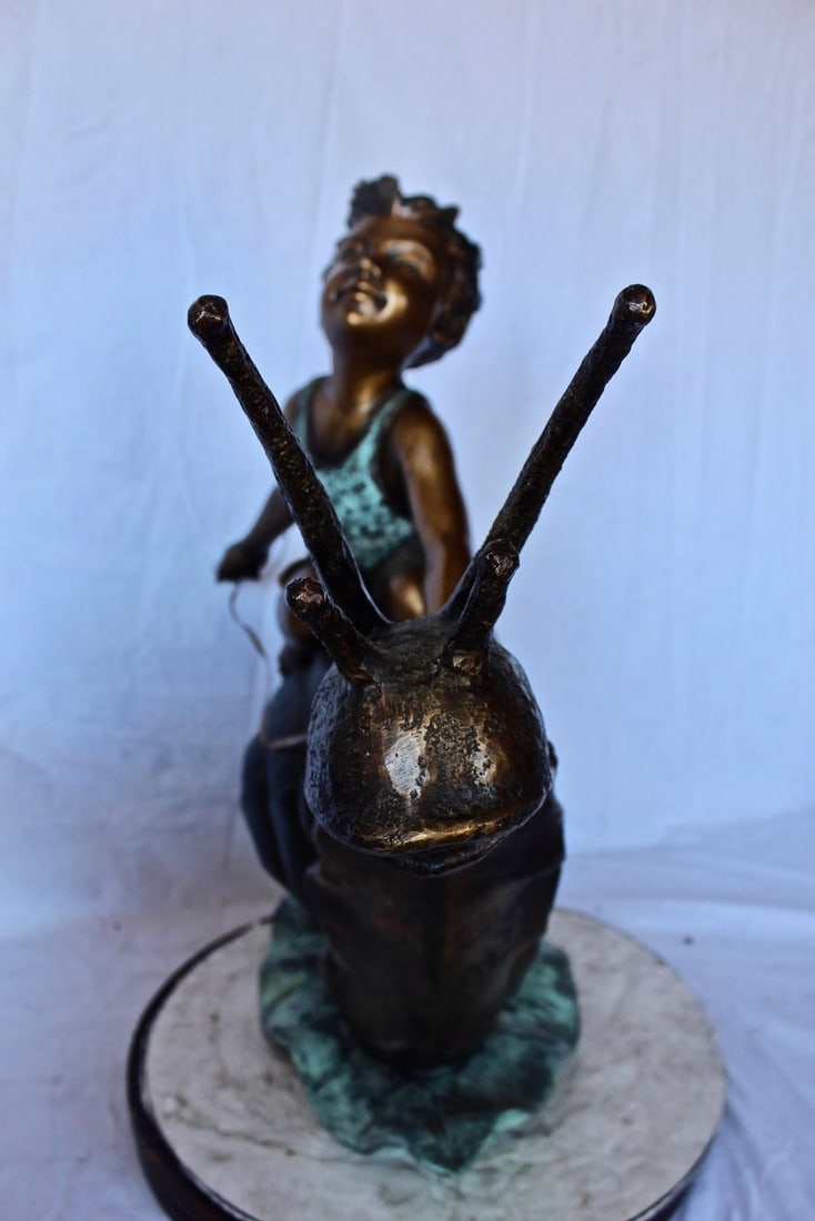 Happy boy riding a snail bronze statue fountain - Size: 42"L x 14"W x 34"H. - 11