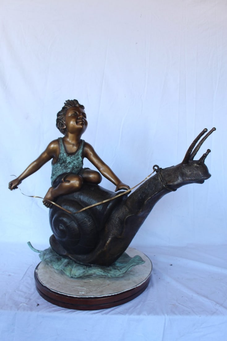 Happy boy riding a snail bronze statue fountain - Size: 42"L x 14"W x 34"H. - 13