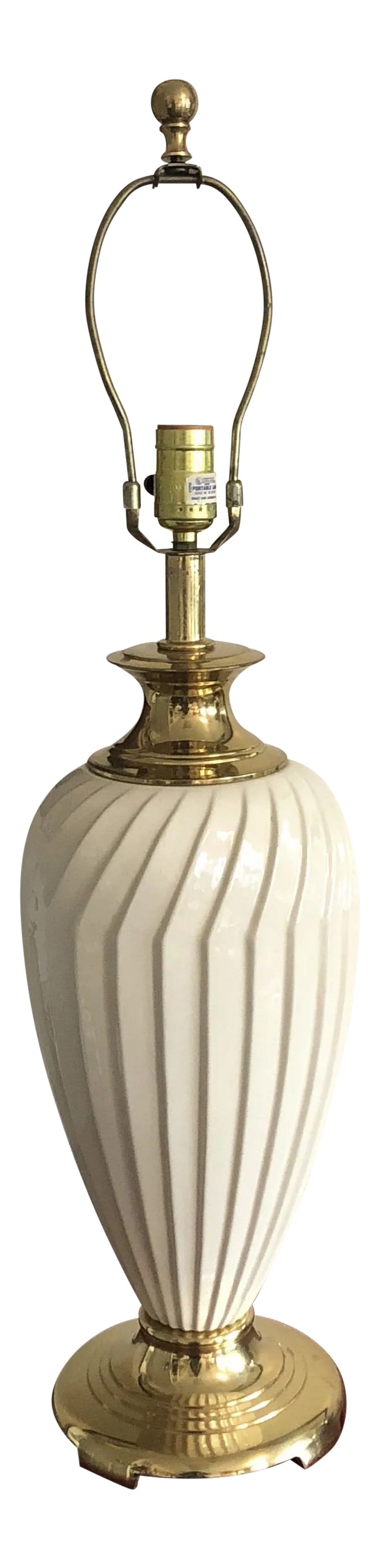 1970s Brass and White Ceramic Reticulated Lamp: Beautiful white lamp with brass details. Perfect for an office space or vanity space. Great for the interior designer. Heavy. Condition: Alterations: Original Condition Unaltered Imperfections: