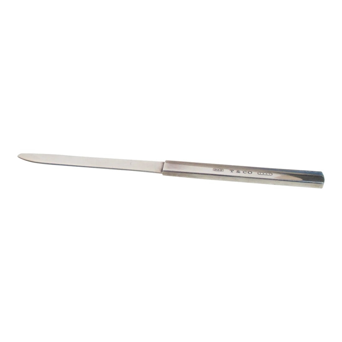 Tiffany & Co Sterling Silver Letter Opener Circa 1998: Sterling silver handle and blade. marked 1998 and Tiffany & Co. 925. Pattern 1837. the size is 8" long and .5" wide. Lovely sleek and efficient blade. All Business and Beauty. INV 64th 